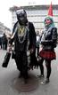 Demonstrators stand in front of the UBS building during the 