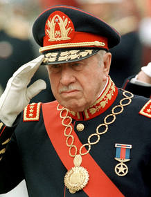 File photo of Pinochet reviewing troops at the Military School in Santiago