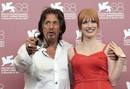 Director and actor Al Pacino gestures as he poses with actress Chastain during a photocall for his film 