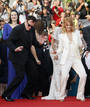 Director Tarantino dances on red carpet with cast member Laurent as they arrive for screening of film 