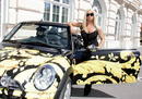 Italian fashion designer Donatella Versace presents a Versace-designed Mini Cooper to photographers ..