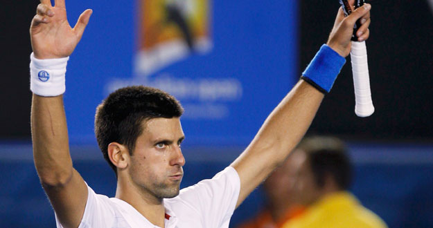 Djokovic of Serbia celebrates after defeating Ferrer of Spain during their quarter-final match at the Australian Open in Melbourne