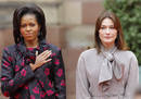 US first lady Obama and Frances first lady Bruni-Sarkozy listen to national anthems in Strasbourg