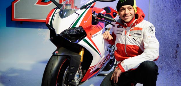 Ducati Moto GP rider Valentino Rossi poses with Ducati 1199 Panigale as he arrives to take part at the "Wrooom, F1 and MotoGP Press Ski Meeting", Ducati and Ferrari's annual media gathering, in Madonna di Campiglio