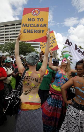 Environmental activists demonstrate outside the United Nations Climate Change conference (COP17) in Durban