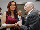 Argentinas First Lady Cristina Fernandez de Kirchner is welcomed by Spanish writer Francisco Ayala at his home in Madrid