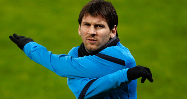 FC Barcelona's Messi warms up during a training session in Leverkusen