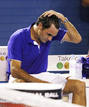 Switzerlands Federer pours water over himself after losing his mens singles final match against Spains Nadal at the Australian Open