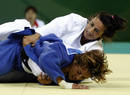 Fernandez of Spain fights with Gotay of the U.S.during their womens -57kg preliminary judo match at the Beijing 2008 Olympic Games