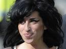 File photo of British singer Amy Winehouse arriving at the City of Westminster Magistrates Court in central London