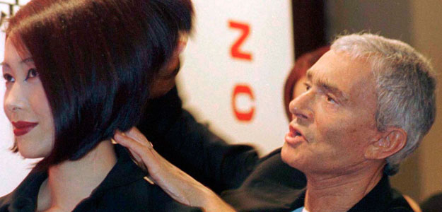 File photo of famed hairdresser Vidal Sassoon helping to style the hair of a model in Shanghai File photo of famed hairdresser Vidal Sassoon helping to style the hair of a model in Shanghai