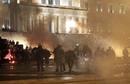 Fireworks and projectiles are aimed at the Greek parliament during violent anti-austerity protests in Athens Syntagma in Athens
