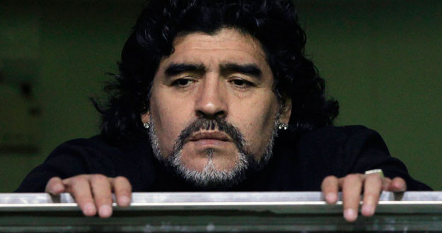 Former Argentine soccer star Maradona watches from a balcony the Argentine first division soccer match between Boca Juniors and Banfield in Buenos Aires