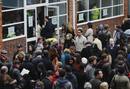 French nationals queue to cast their votes in Frances Presidential election at the Lycee Francais Charles de Gaulle in London