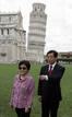Chinas President Hu and his wife pose in front of the Leaning Tower in Pisa