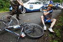 Garmin-Transitions Tyler Farrar of the U.S sits on the road after a crash in the second stage of the Tour de France cycling race from Brussels to Spa