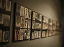 Photographs of Rwandan genocide victims are shown on a gallery wall during a visit by U.S. President Bush and first lady Laura in Kigali