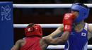 Ghanas Dogboe fights against Japans Shimizu in the Mens Bantam (56kg) Round of 32 boxing match during the London 2012 Olympic Games