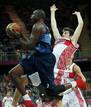 Great Britains Deng gets past Russias Karasev during their mens Group B basketball match at the London 2012 Olympic Games in the Basketball arena