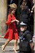 A guest arrives for the wedding between Britains Zara Phillips and Mike Tindall at Canongate Kirk in Edinburgh