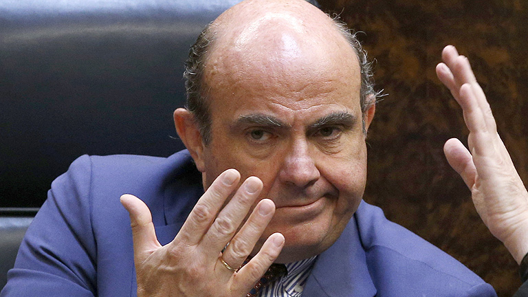 Guindos llega a Berl&iacute;n con la prima y la bolsa disparadas