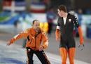Kramer of the Netherlands looks at his coach Kemkers after finishing his race in the mens 10000 metres speed skating competition at the Vancouver 2010 Winter Olympics