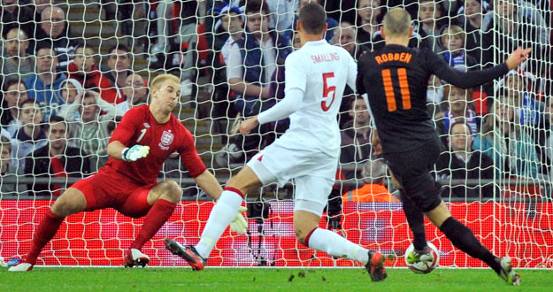 Holland's Arjen Robben scores against England during their international friendly soccer match at Wembley Stadium in London