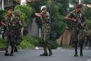 Honduran soldiers block a street near the residence of Honduras President Manuel Zelaya in Tegucigalpa