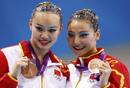 Chinas Huang Xuechen (L) and Liu Ou pose with their bronze medals during the synchronised swimming duets victory ceremony at the London 2012 Olympic Games at the Aquatics Centre