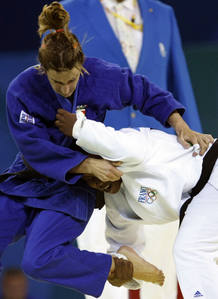 Iglesias of Spain fights with Emane of France during their women's -70kg preliminary judo match at the Beijing 2008 Olympic Games