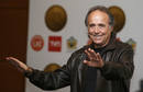 Spanish singer and composer Joan Manuel Serrat gestures during a news conference in Vina Del Mar