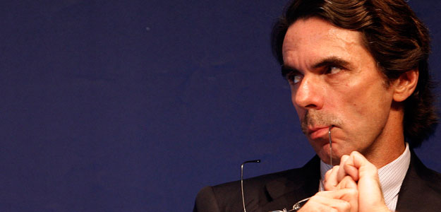 Former Spanish PM Aznar listens to a speaker during a conference on globalization in Estoril, near Lisbon