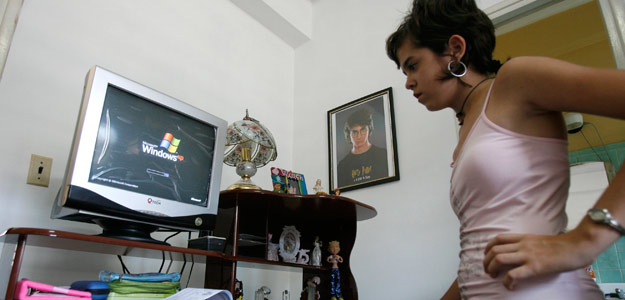 Amanda turns on her brand-new computer that her parents have just bought in Havana