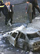 Baltasar Garzon y el director general de la Polic&iacute;a Nacional, Juan Cotino, inspeccionan la zona en la que un coche bomba de ETA caus&oacute; la muerte al juez del Tribunal Supremo Jos&eacute; Francisco Querol Lombardero, su conductor y su guardaespaldas,