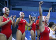 Spain's team players celebrate winning during their women's water polo quarterfinal round against Great Britain at Water Polo Arena during London 2012 Olympic Games