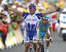 Katushas Joaquin Rodriguez Oliver of Spain celebrates as he crosses the finish line to win ahead of Astanas Alberto Contador of Spain during the 12th stage of the Tour de France cycling race between Bourg-de-Peage and Mende