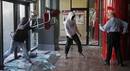 A man confronts protesters who were vandalising a bank facility during protests against cuts in education in Barcelona