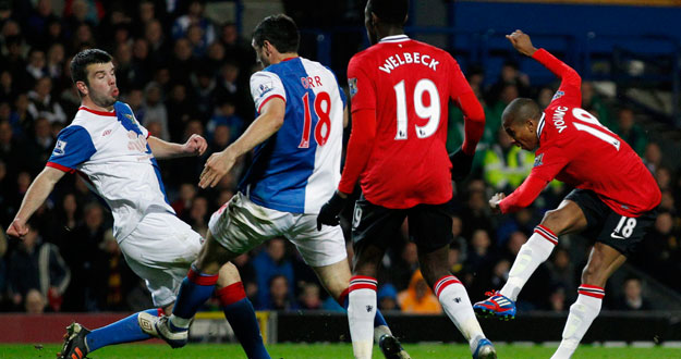 Manchester United's Young scores against Blackburn Rovers during their English Premier League soccer match in Blackburn