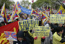 Pro-Tibet supporters shout slogans during the Olympic torch relay in Nagano