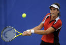 Maria Jose Martinez Sanchez of Spain returns a shot against Alicia Molik of Australia during their womens first round tennis match at the Beijing 2008 Olympic Games