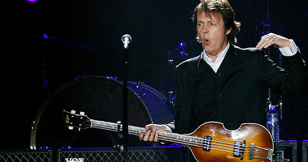 Paul McCartney, formerly a member of The Beatles, performs with his band during a concert at CitiField in New York