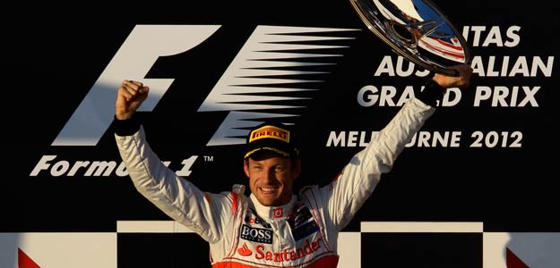 McLaren Formula One driver Button celebrates his victory on the podium after the Australian F1 Grand Prix at the Albert Park circuit in Melbourne