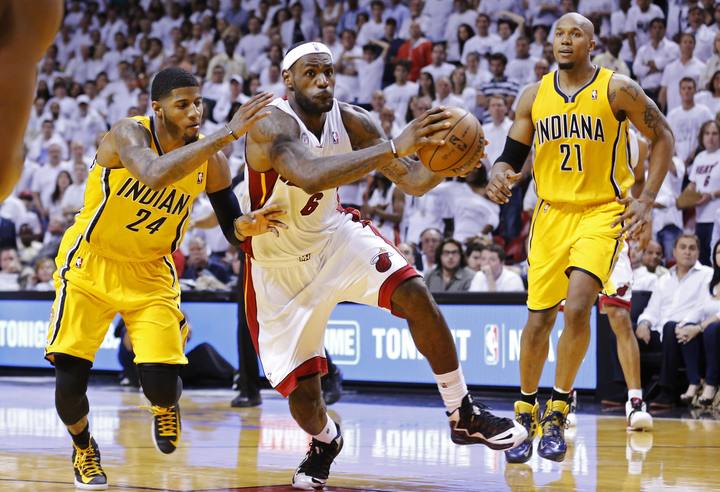Miami Heat's James drives through Indiana Pacers' defense during their NBA Eastern Conference final basketball playoff in Miami