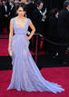 Mila Kunis con un modelo de Ellie Saab en tonos malva, uno de los colores triunfadores de la noche