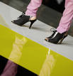 A model displays an outfit by 