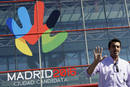 Spains Olympic bronze medalist in fencing, Jose Luis Abajo, poses in front of the logo for Madrids 2016 Olympic bid