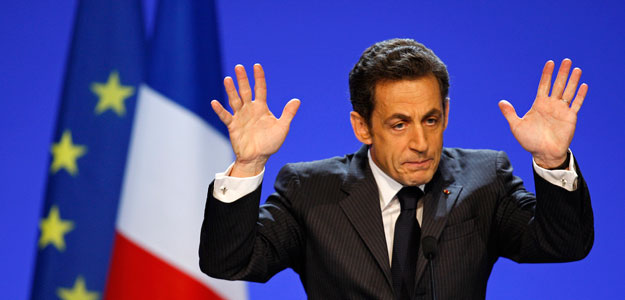 France's President Nicolas Sarkozy announces a 26 billion euro stimulus plan for the faltering economy during a speech in Douai