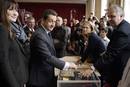 Nicolas Sarkozy, Frances President and UMP party candidate for his re-election, votes in the second round of the presidential elections with his wife Carla Bruni-Sarkozy in Paris