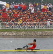 Spectators cheer as Nuria Dominguez of Spain takes part in the womens single Sculls heat 2 rowing competition during the Beijing 2008 Olympic Games