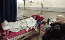 Palestinian woman wounded lies in hospital in Gaza